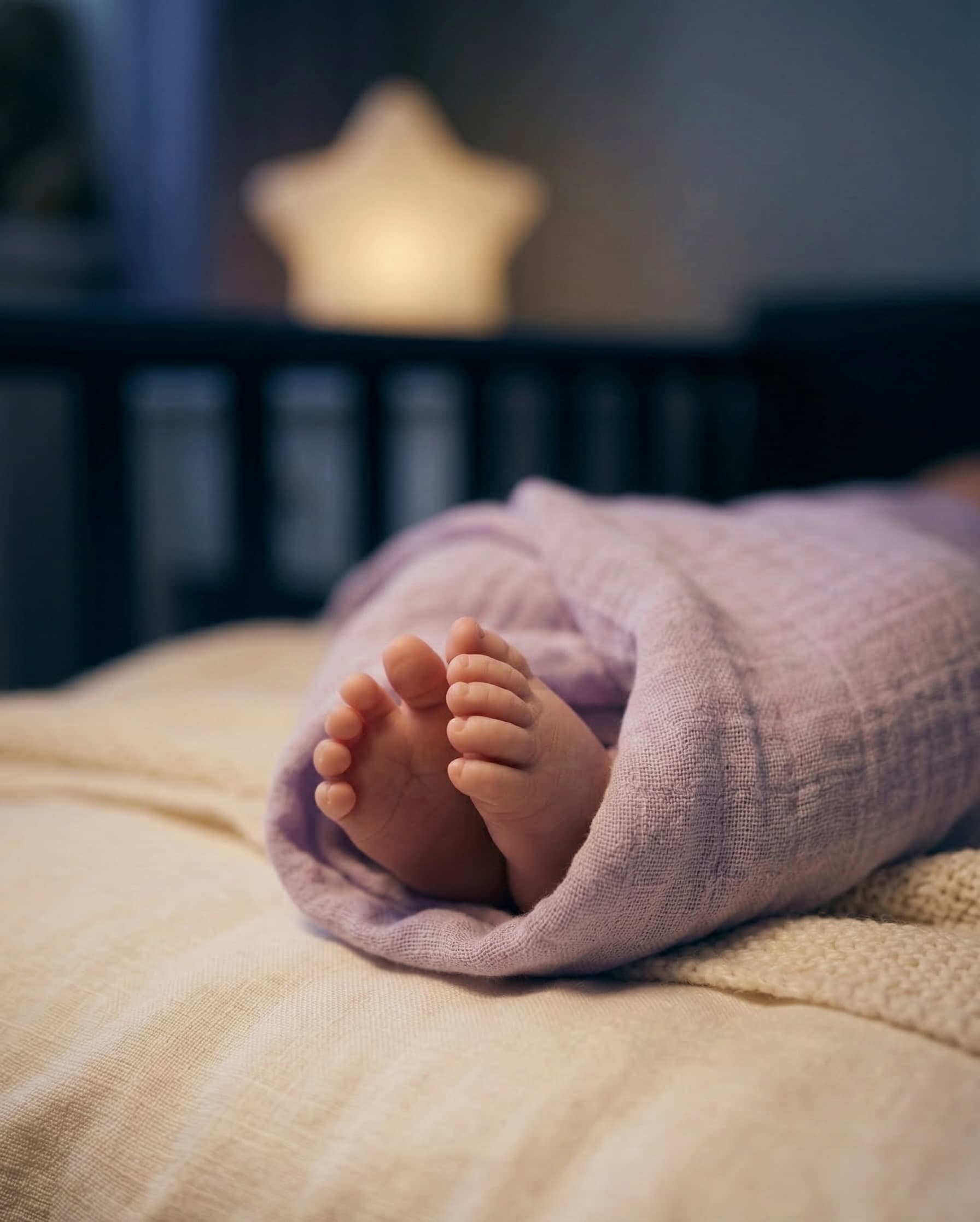 Sleeping baby wrapped in a blanket